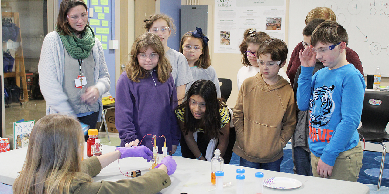 Students watch experiments